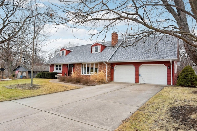 cape cod home featuring a garage and a front lawn