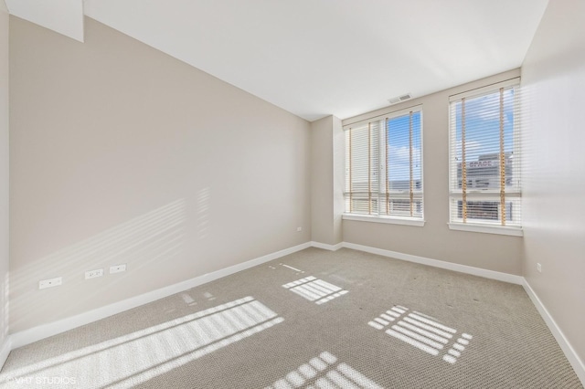 spare room featuring carpet flooring