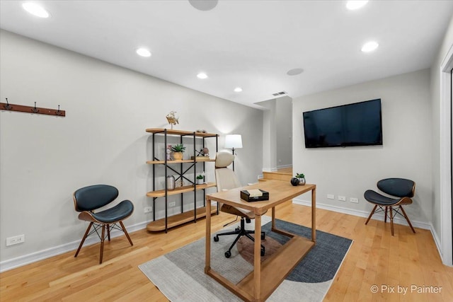 home office with hardwood / wood-style flooring