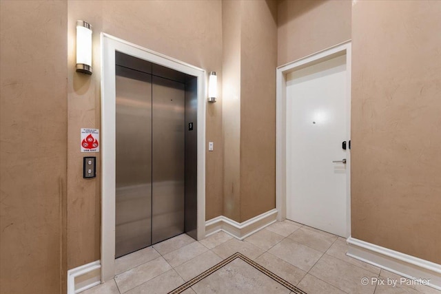 view of exterior entry featuring elevator