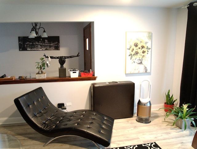 sitting room with hardwood / wood-style flooring