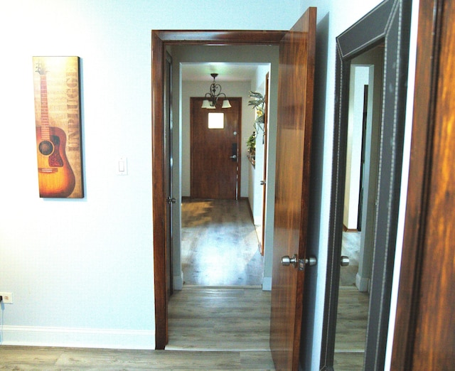 hallway with wood-type flooring