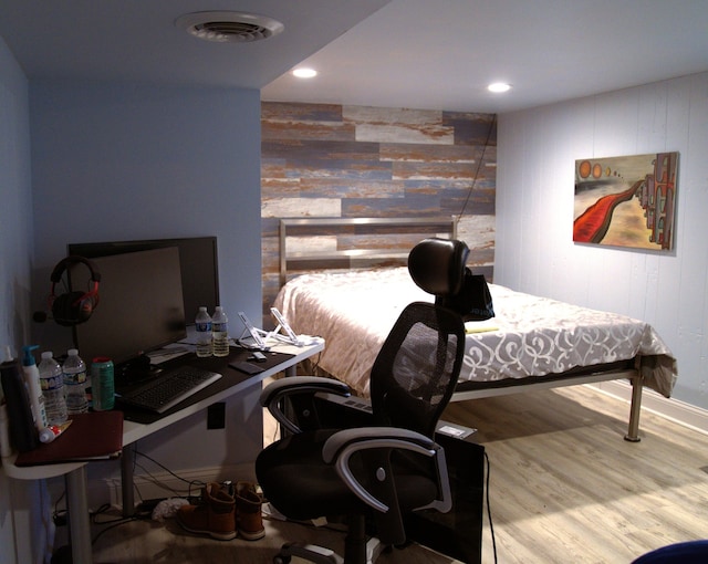 bedroom featuring hardwood / wood-style flooring