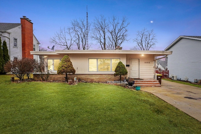 view of front of property with a lawn