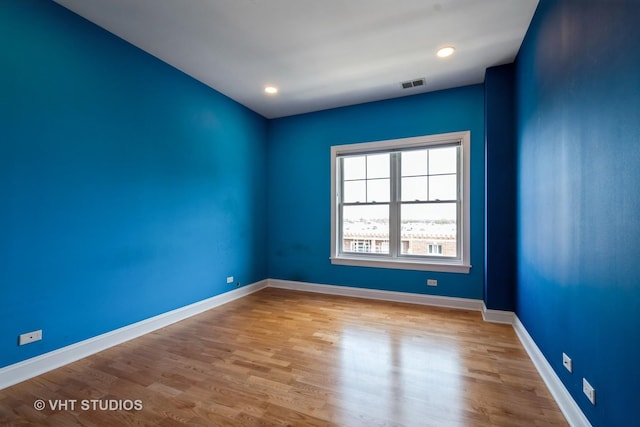 4953 Oakton St Unit 605, Skokie, IL 60077 - spare room featuring wood finished floors and baseboards