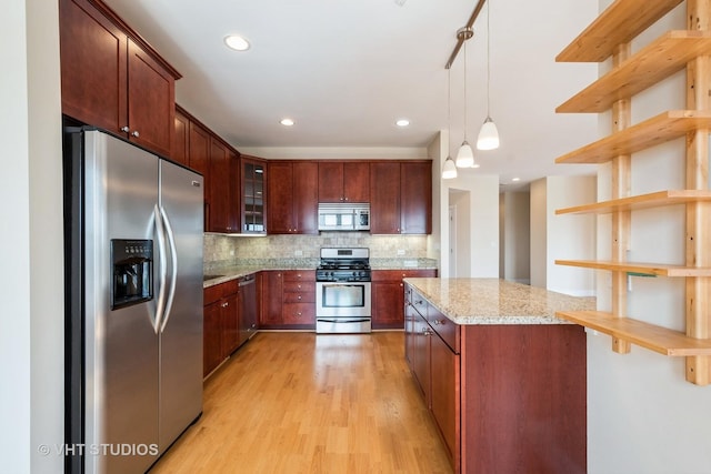 4953 Oakton St Unit 605, Skokie, IL 60077 - kitchen with stainless steel appliances, open shelves, light wood-type flooring, pendant lighting, and decorative backsplash