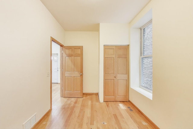 816 N Hermitage Ave, Chicago, IL 60622 - unfurnished bedroom with light wood finished floors and baseboards