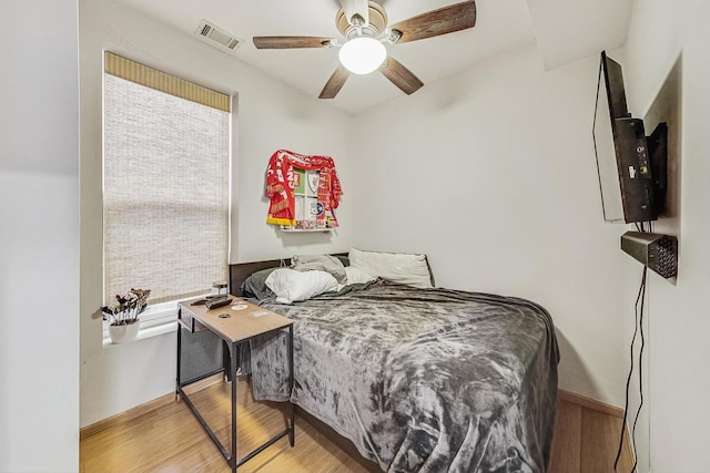 816 N Hermitage Ave, Chicago, IL 60622 - bedroom featuring wood finished floors, multiple windows, and a ceiling fan