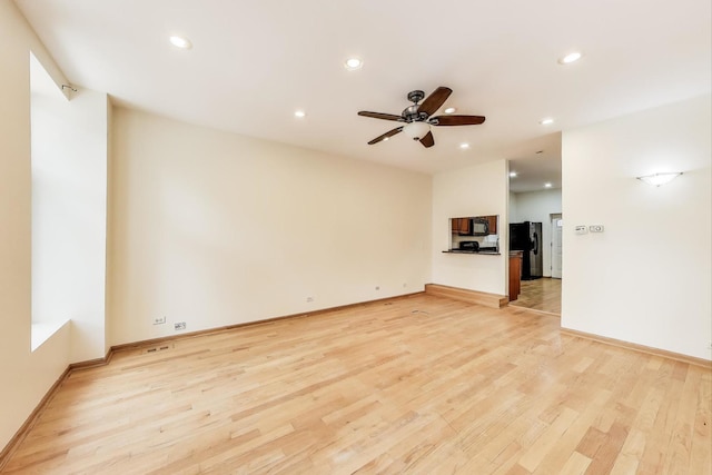 816 N Hermitage Ave, Chicago, IL 60622 - unfurnished living room with light wood-style floors, a ceiling fan, recessed lighting, and baseboards