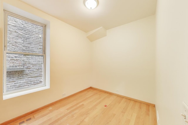 816 N Hermitage Ave, Chicago, IL 60622 - spare room with light wood-style floors and baseboards