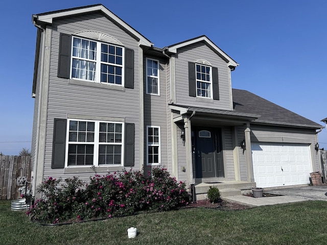 view of front of house featuring a garage and a front yard