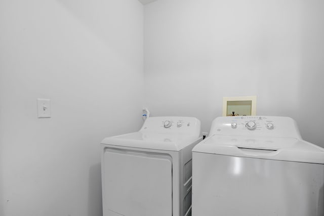 laundry area with separate washer and dryer