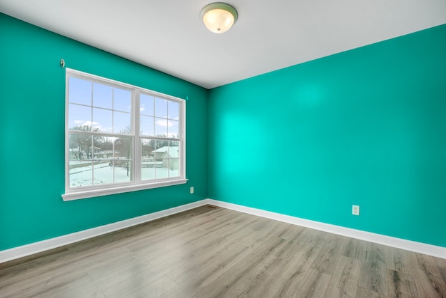 unfurnished room featuring light hardwood / wood-style flooring