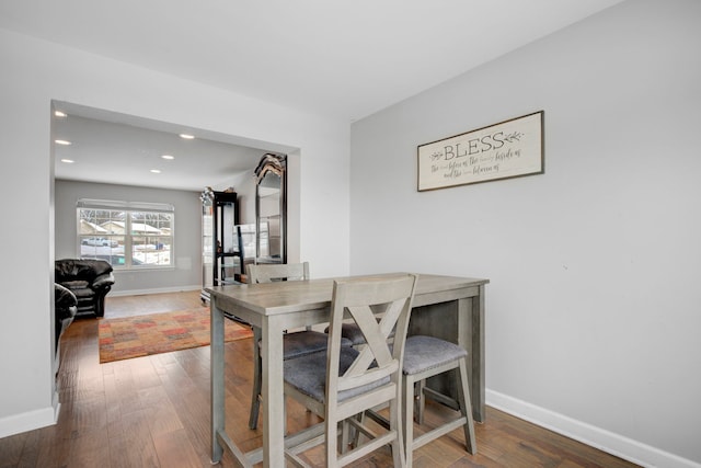 dining area with hardwood / wood-style floors