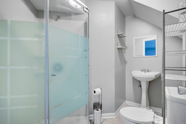 bathroom featuring tile patterned flooring, walk in shower, and toilet