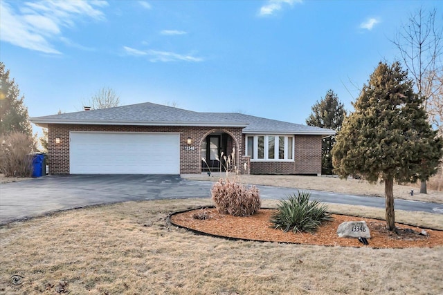 single story home featuring a garage