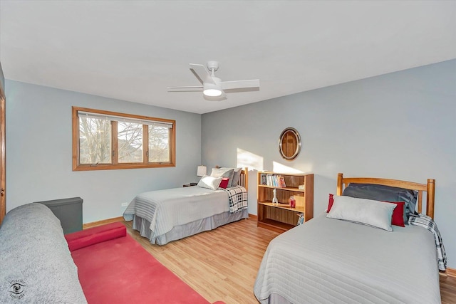 bedroom featuring ceiling fan and hardwood / wood-style floors