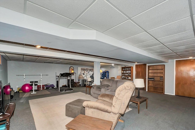 living room with a drop ceiling