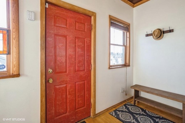 entryway with wood finished floors