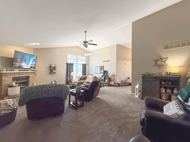 carpeted living area with vaulted ceiling, ceiling fan, a brick fireplace, and visible vents