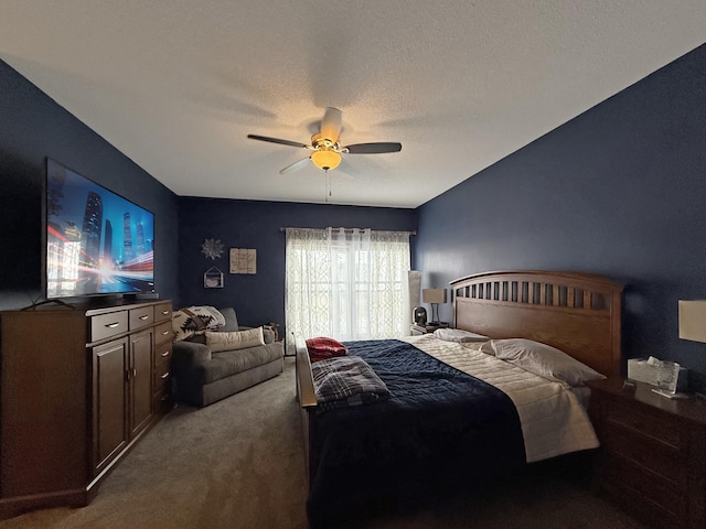 bedroom featuring carpet floors, a textured ceiling, and a ceiling fan