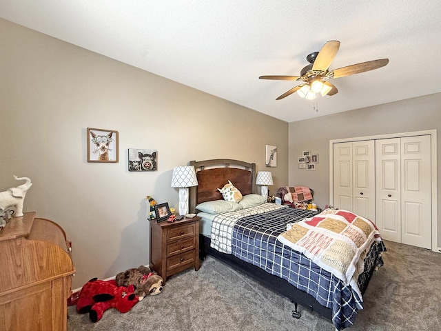 carpeted bedroom with ceiling fan, a textured ceiling, and a closet