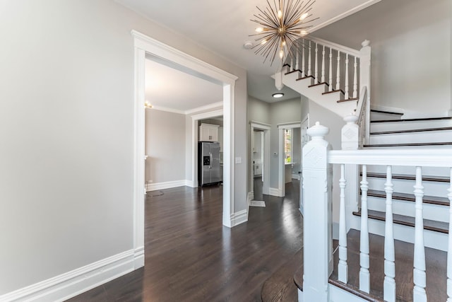 interior space featuring crown molding, wood-type flooring, and a chandelier