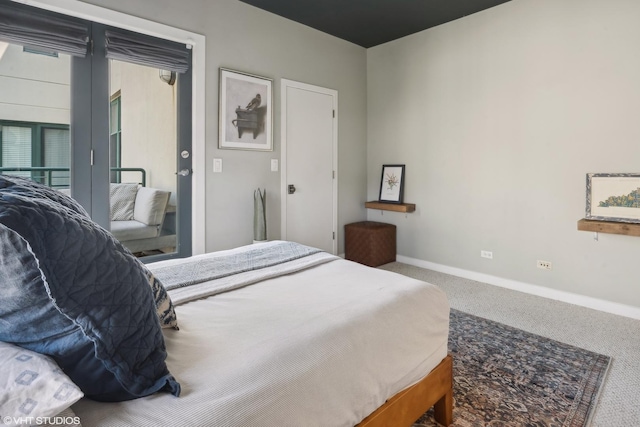 bedroom featuring carpet flooring and access to outside