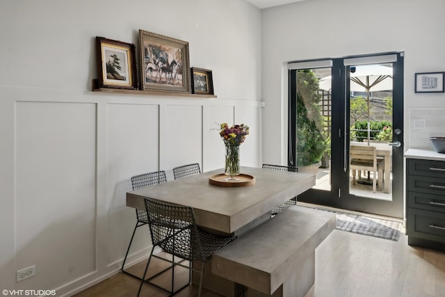 dining area with wood-type flooring