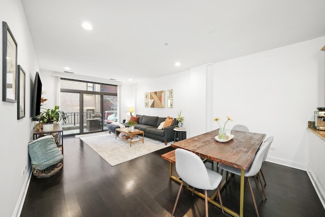 dining area featuring dark wood-type flooring and french doors