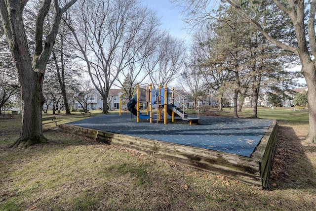 view of playground with a lawn