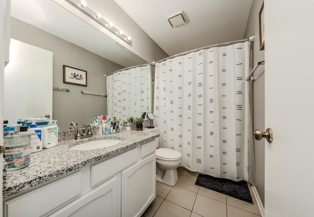 bathroom with tile patterned floors, toilet, a shower with shower curtain, and vanity