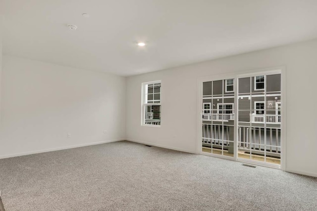 unfurnished room with carpet floors