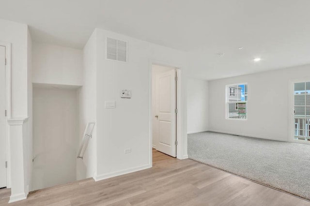 unfurnished room with light hardwood / wood-style floors