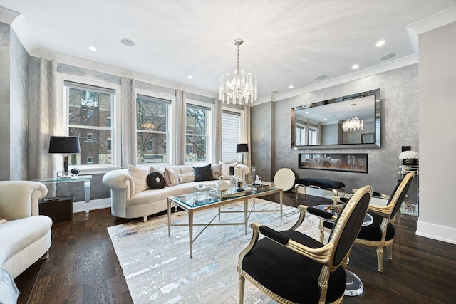 living room featuring hardwood / wood-style flooring, plenty of natural light, and a large fireplace