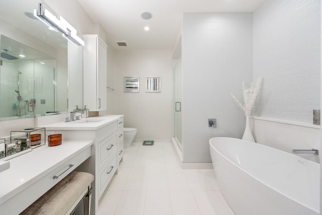 full bathroom featuring vanity, tile patterned flooring, plus walk in shower, and toilet