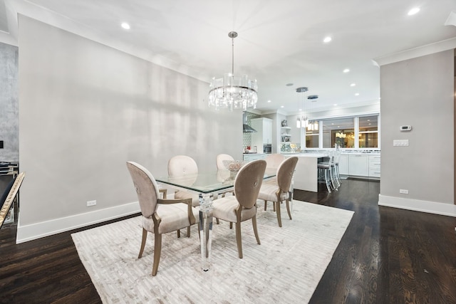 dining area featuring crown molding, dark hardwood / wood-style floors, and a chandelier