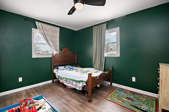 bedroom featuring hardwood / wood-style floors and ceiling fan