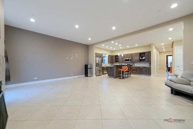 living room with light tile patterned flooring