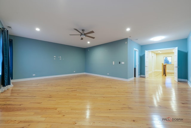 unfurnished living room with ceiling fan and light hardwood / wood-style flooring