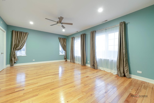 empty room featuring light hardwood / wood-style floors and ceiling fan