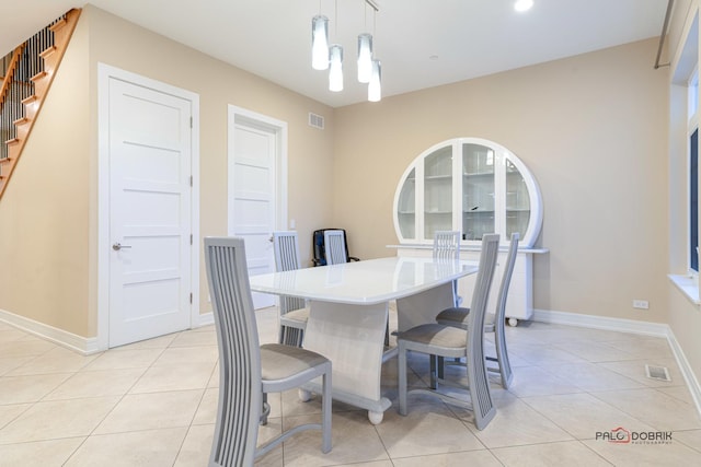 dining area featuring light tile patterned floors