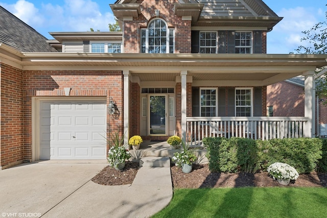 view of front of home with a garage and covered porch