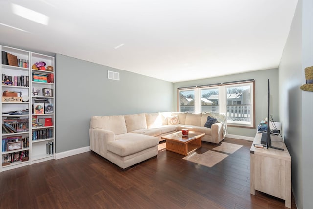 living room with dark hardwood / wood-style floors