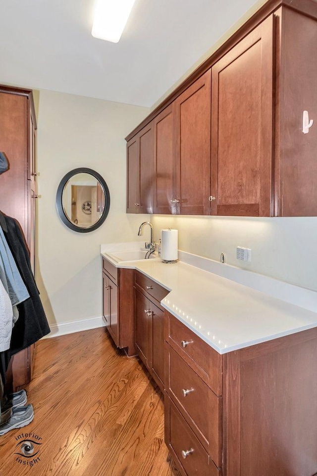 kitchen featuring sink and light hardwood / wood-style flooring