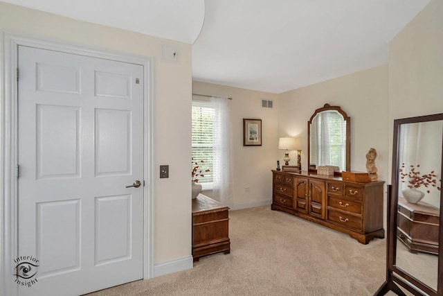 bedroom with light carpet