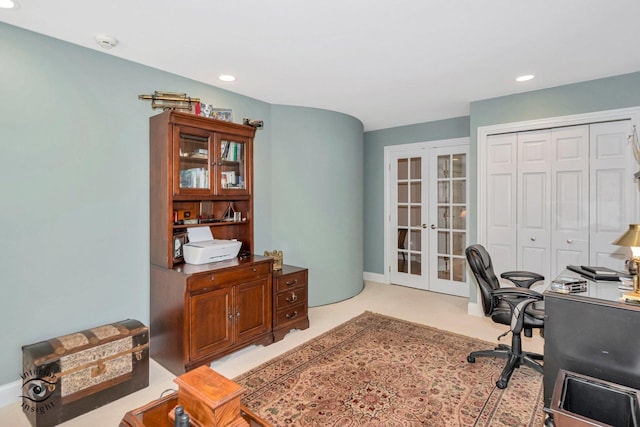 carpeted office featuring french doors