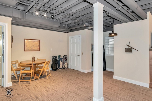 dining area featuring light hardwood / wood-style flooring and track lighting