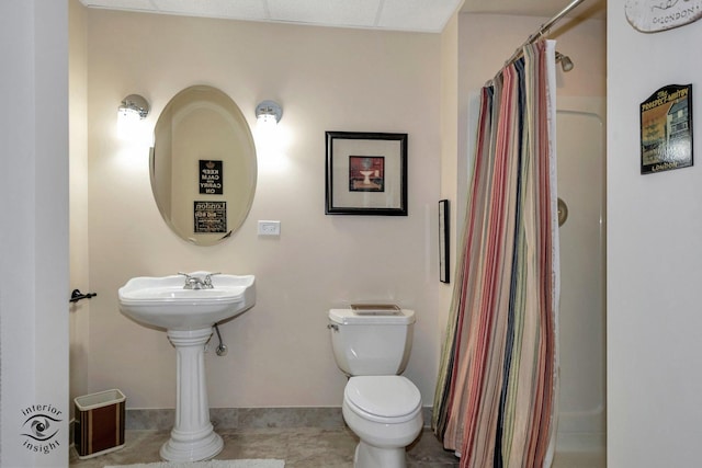 bathroom with walk in shower and toilet