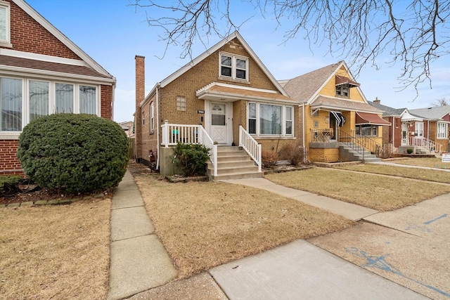 bungalow-style house with a front yard